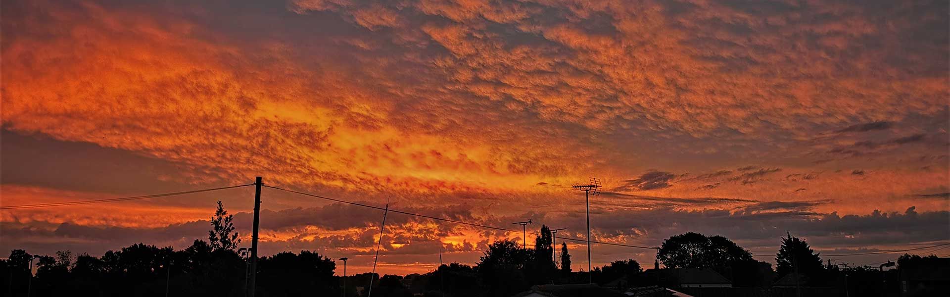 Sunset over the Village Hall. Credit: Steve Barrett